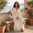 FJØRNA summer dress for women with long sleeves and a slit, featuring lightweight fabric and a relaxed fit for warm weather.