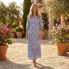 Printed V-neck midi dress by FJØRNA with relaxed fit, featuring a floral pattern and flowing fabric.