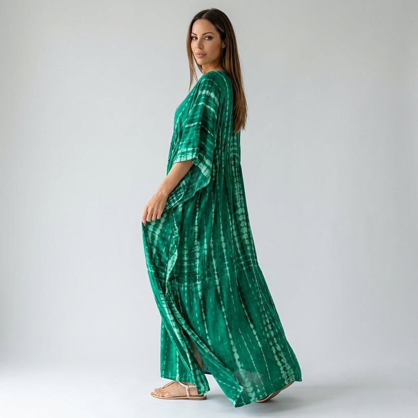 FJØRNA boho printed maxi dress with loose fit and V-neck, featuring vibrant patterns and flowy fabric, ideal for casual wear.