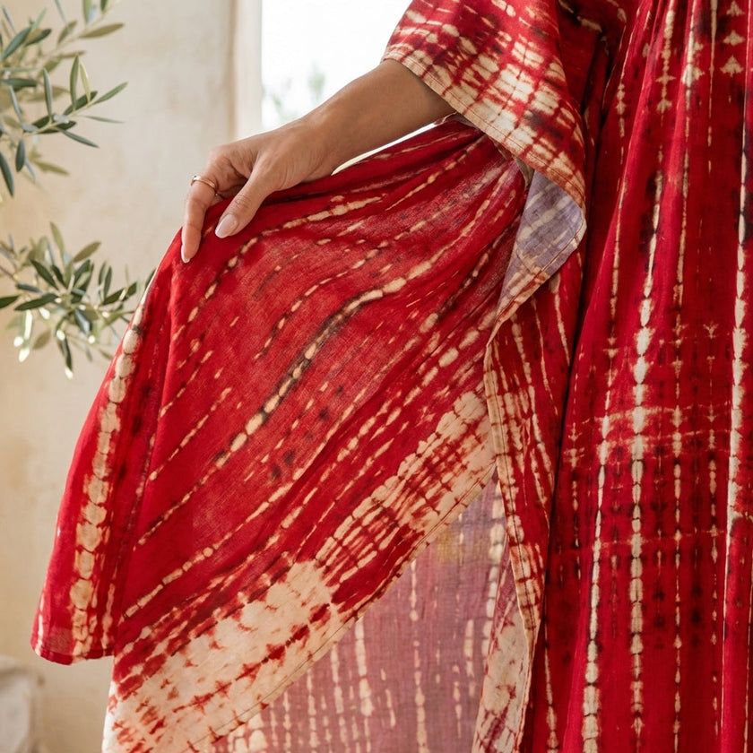 FJØRNA boho printed maxi dress with loose fit and V-neck, features vibrant patterns and flowing fabric.