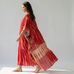 FJØRNA boho printed maxi dress with loose fit and V-neck, featuring vibrant patterns and flowing fabric in a casual, comfortable style.