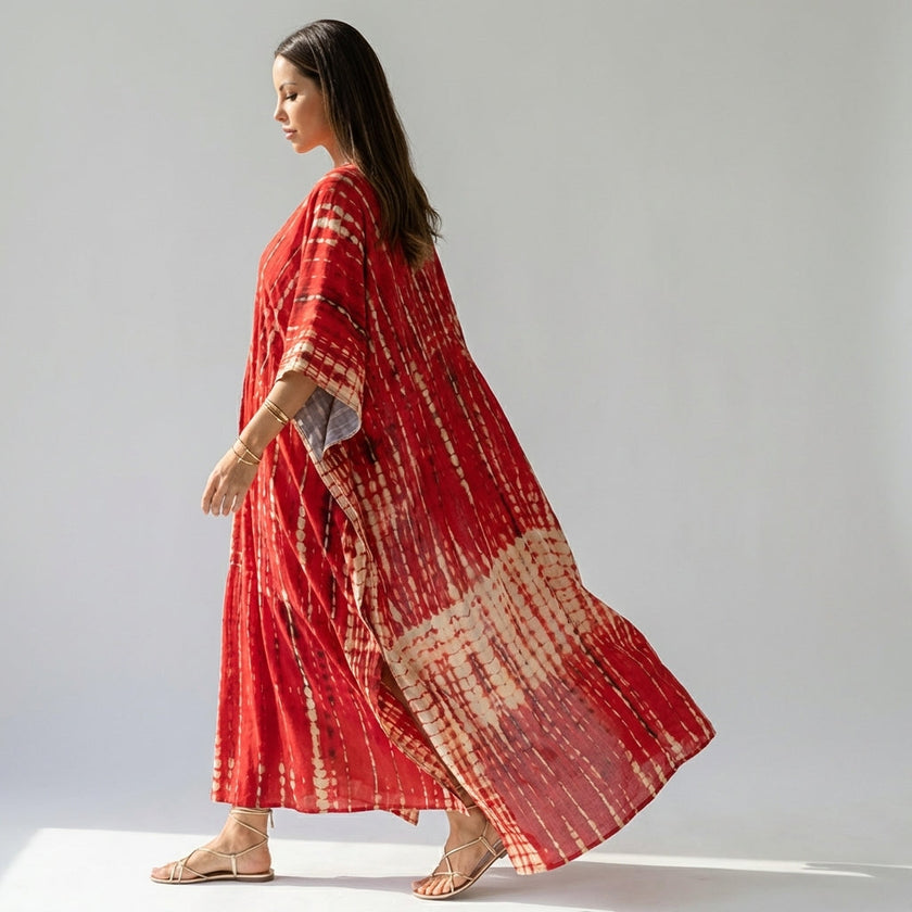 FJØRNA boho printed maxi dress with loose fit and V-neck, featuring vibrant patterns and flowing fabric in a casual, comfortable style.
