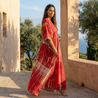 FJØRNA boho printed maxi dress with loose fit and V-neck, featuring vibrant patterns and flowing fabric for a relaxed, stylish look.