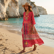 FJØRNA boho embroidered midi dress with loose fit and V-neck, featuring colorful embroidery and flowing fabric.