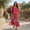 FJØRNA boho embroidered midi dress with loose fit and V-neck, featuring intricate embroidery and flowing fabric.