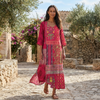 FJØRNA boho embroidered midi dress with loose fit and V-neck, featuring intricate embroidery and flowing fabric.