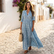 FJØRNA printed long sleeve maxi dress with V-neck and relaxed fit, flowing fabric and stylish design.