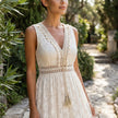 FJØRNA boho lace tiered maxi dress with V-neck, flowing fabric, and intricate lace details, perfect for casual or bohemian style.