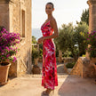 FJØRNA printed satin slip midi dress with side slit, showcasing a smooth satin fabric and elegant design.