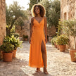 FJØRNA printed satin slip midi dress with side slit, showcasing smooth fabric, delicate print, and elegant silhouette.