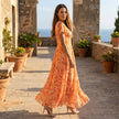 FJØRNA floral chiffon midi dress with short sleeves and a flowy skirt, perfect for spring or summer occasions.