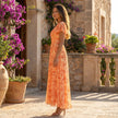 FJØRNA floral chiffon midi dress with short sleeves and a flowy skirt, perfect for elegant summer occasions.