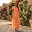 FJØRNA floral chiffon midi dress with short sleeves and a flowy skirt, perfect for summer or special occasions.