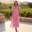 FJØRNA floral chiffon midi dress with short sleeves and a flowy skirt, showcased on a model against a neutral background.