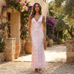 FJØRNA floral lace maxi dress with V-neck and slim fit, featuring intricate lace details and elegant silhouette.