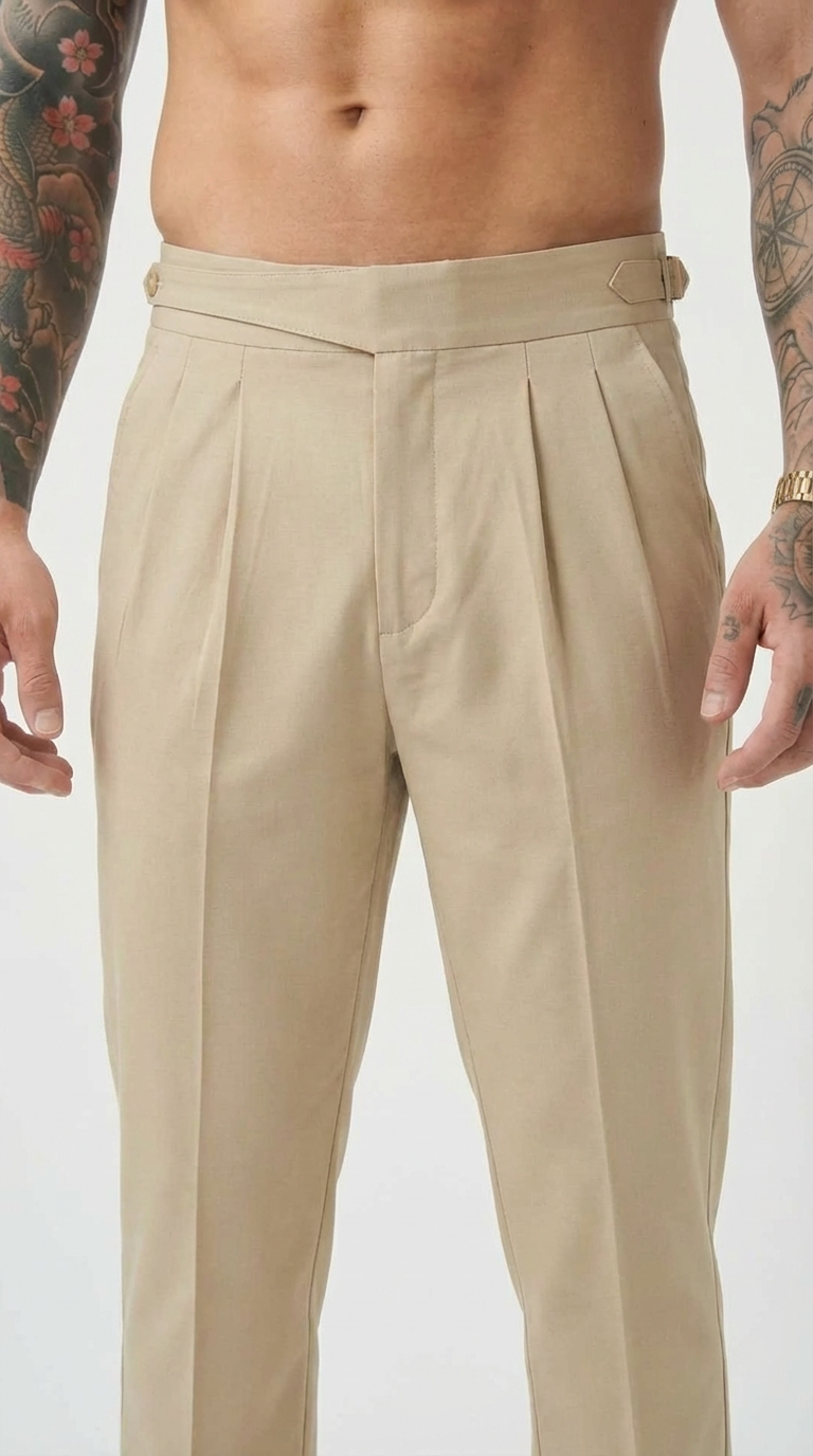 FJØRNA tailored cream trousers with a slim fit, featuring a classic waistband and front pockets, stylishly displayed on a model.