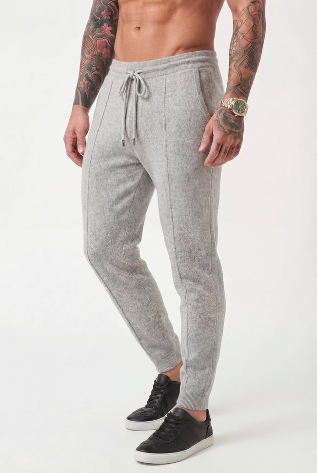 Men's light grey merino wool trousers by FJØRNA, stylish and comfortable pants for everyday wear.