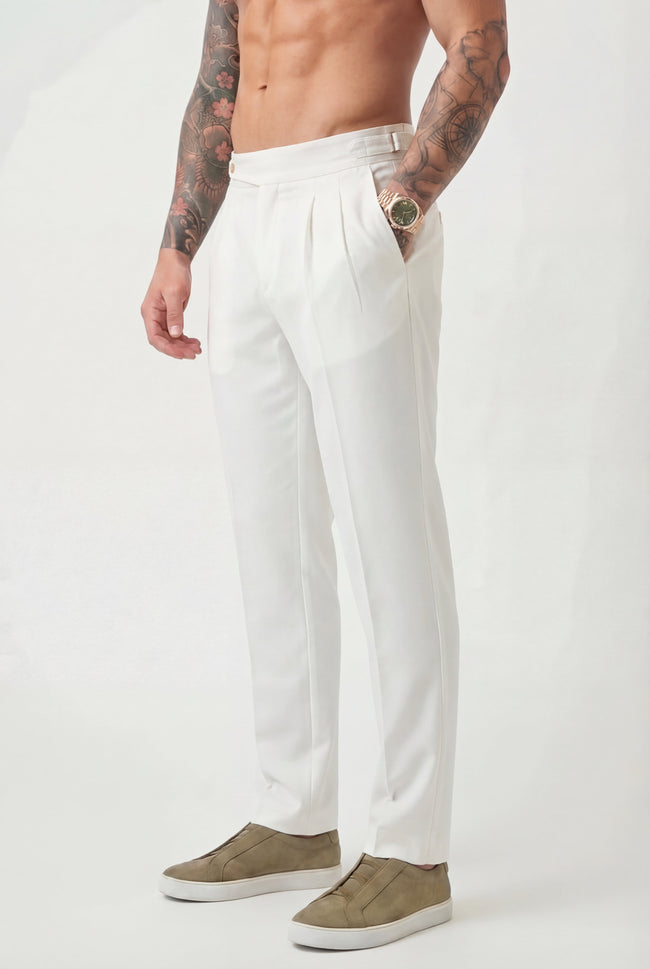 Men's tailored white trousers by FJØRNA, showcasing a slim-fit design with clean lines and modern style.