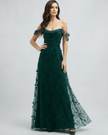 FJØRNA women's lace maxi dress featuring intricate lace details and flowing fabric, full-length fashion dress on a model.