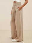 FJØRNA linen summer trousers for women with high waist, wide-leg design, drawstring waist, made of lightweight cotton-linen fabric.