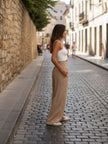 FJØRNA women's linen summer trousers with high waist, wide leg, and drawstring detail, made of breathable cotton-linen fabric.