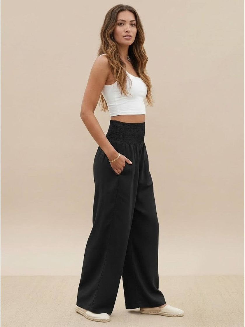 FJØRNA women's linen summer trousers with high waist, wide leg design and drawstring waist for a comfortable, relaxed fit.
