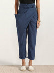 FJØRNA lightweight summer women's trousers with high waist, wide leg, and pocket details, featuring a comfortable, relaxed fit.