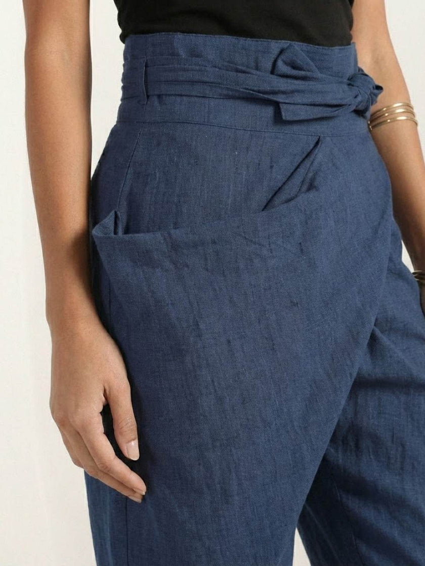 FJØRNA lightweight summer women's high waist wide-leg trousers with pockets, made from comfortable, breathable fabric.