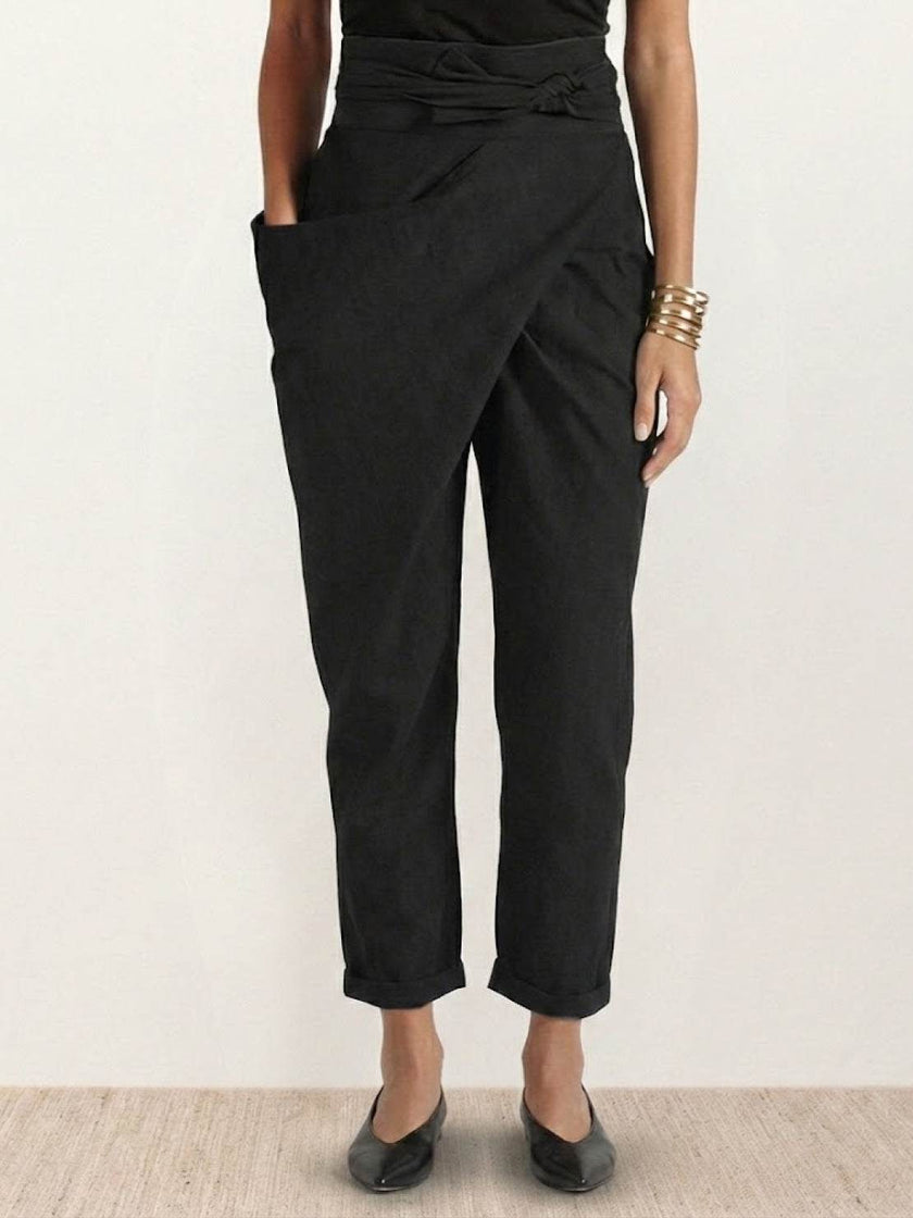FJØRNA lightweight summer women's trousers with high waist, wide-leg fit, and side pockets, designed for comfort and style.