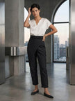 FJØRNA women's lightweight summer trousers with high waist, wide leg design, and front pockets, made for comfortable style.