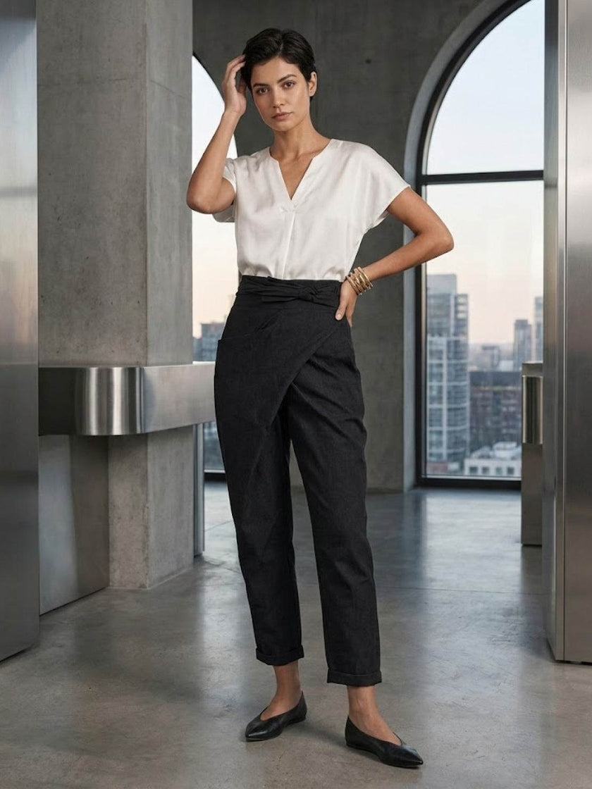 FJØRNA women's lightweight summer trousers with high waist, wide leg design, and front pockets, made for comfortable style.