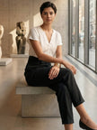 FJØRNA women's lightweight summer trousers with high waist, wide-leg fit, and side pockets, designed for comfort and style.