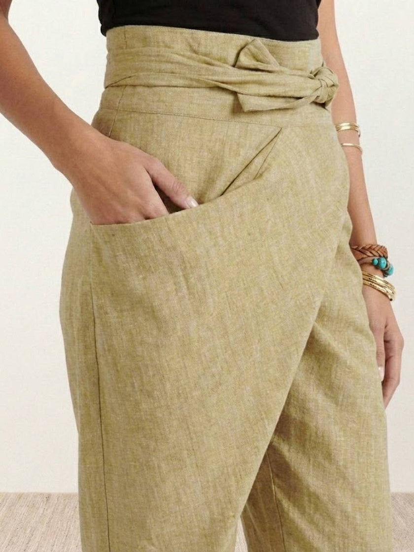 FJØRNA women's lightweight summer trousers with high waist, wide leg fit, and side pockets, designed for comfort and style.