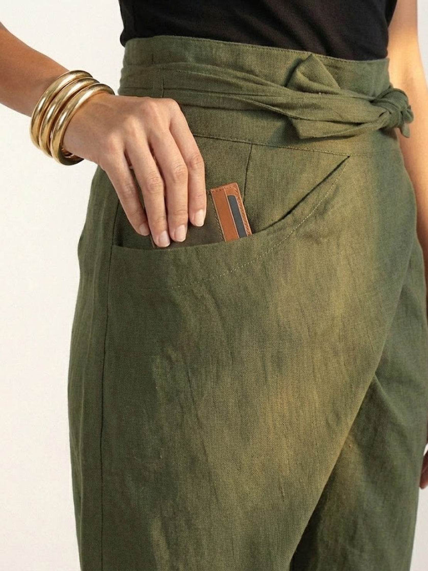 FJØRNA lightweight summer women's trousers with high waist and wide leg style, featuring side pockets and a comfortable fit.