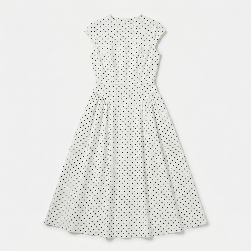 FJØRNA women's polka dot maxi dress with round neckline and A-line silhouette, flowing and stylish for elegant occasions.