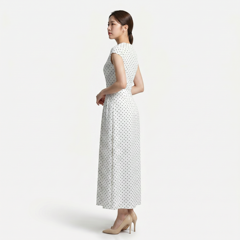 FJØRNA women's polka dot maxi dress with round neckline and A-line silhouette, flowing and stylish for casual or formal wear.