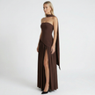 Women's elegant strapless maxi dress by FJØRNA, flowing fabric, fitted bodice, and floor-length design perfect for formal occasions.