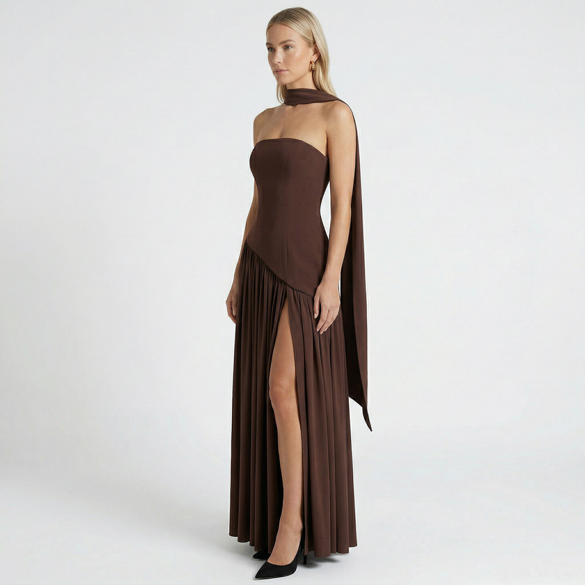 Women's elegant strapless maxi dress by FJØRNA, flowing fabric, fitted bodice, and floor-length design perfect for formal occasions.