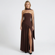 FJØRNA women's elegant strapless maxi dress in flowing fabric, featuring a fitted bodice and long, graceful skirt.