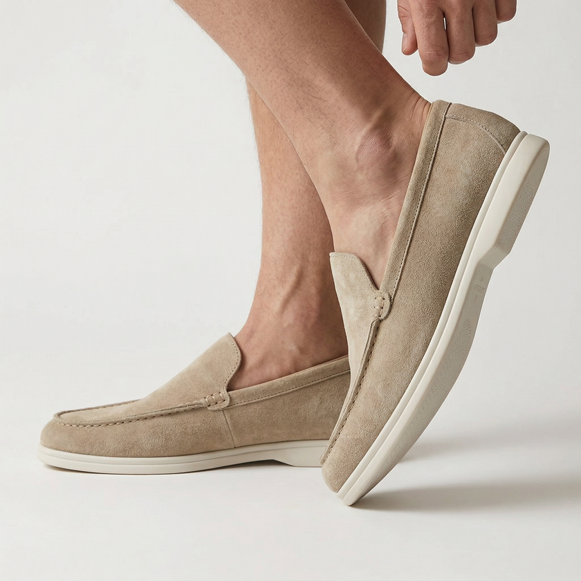 FJØRNA men's classic summer slip-on loafers in light tan leather with stitched detailing and a low heel, displayed on a neutral background.