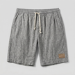 Men's FJØRNA linen shorts with elastic waistband and drawstring, designed for summer beachwear and casual comfort.