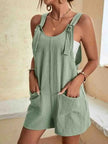 FJØRNA Daisy women's casual romper shorts with pockets, featuring a relaxed fit and lightweight fabric, shown in a neutral color.
