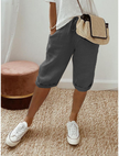 FJØRNA lightweight summer capri pants for women with relaxed fit and drawstring, breathable fabric, shown on a model.