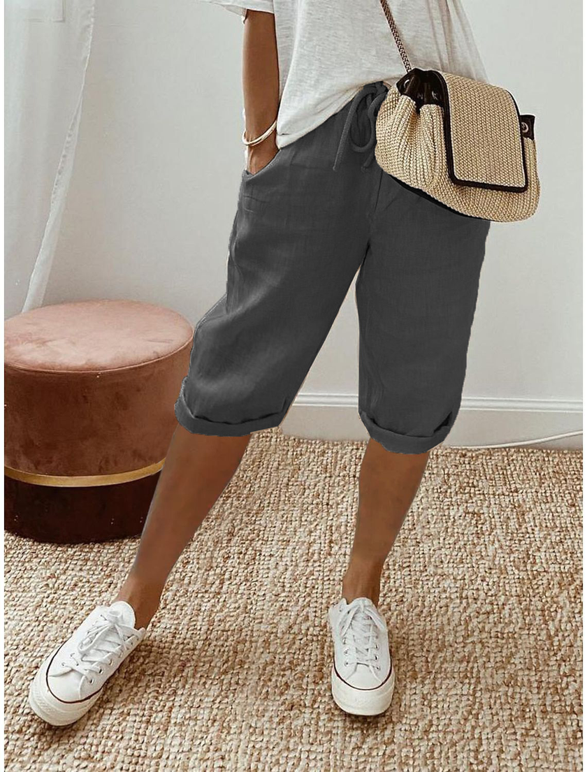 FJØRNA lightweight summer capri pants for women with relaxed fit and drawstring, breathable fabric, shown on a model.