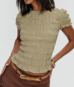 White plaid ruffle-detail women's blouse by FJØRNA, stylish top with ruffles and classic plaid pattern.