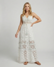 FJØRNA bohemian lace maxi dress with tiered skirt and tassel waist, featuring intricate lace details and flowing silhouette.