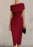 FJØRNA black asymmetric one-shoulder midi dress, stylish cocktail dress with a sleek design and elegant fit, displayed on a mannequin.