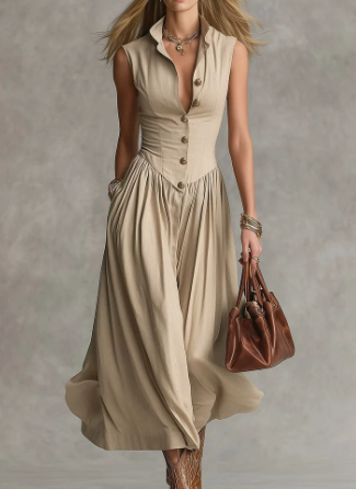 FJØRNA Martina elegant white flowy midi dress displayed on a hanger with soft fabric details.