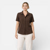 FJØRNA women's short sleeve button-up shirt, classic style with a tailored fit, displayed on a hanger against a white background.