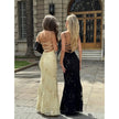 Women's floral Jacquard corset maxi dress by FJØRNA, featuring intricate floral patterns and a fitted bodice on a model.